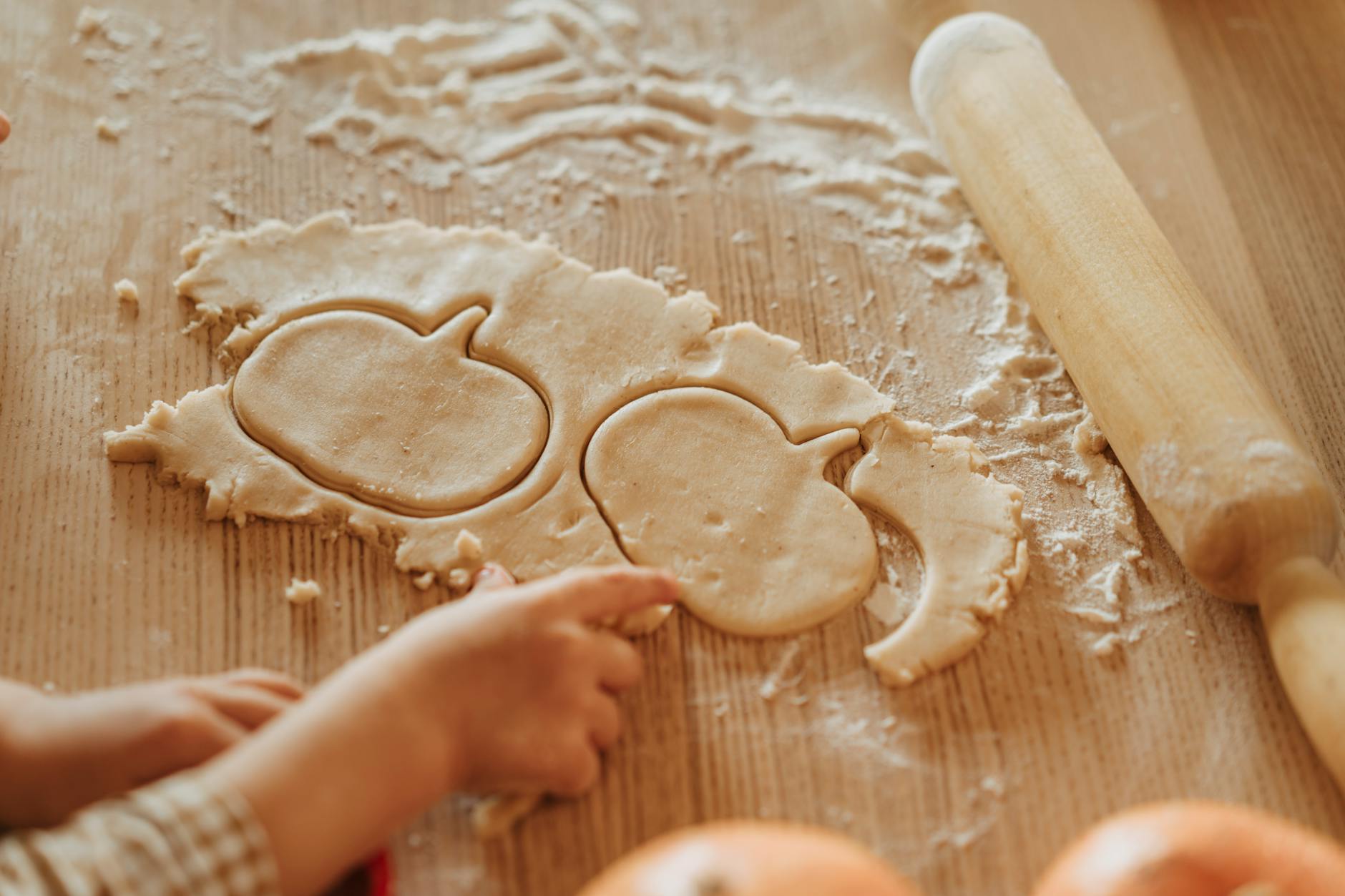 making pumpkin shaped cookies